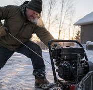 A difficult manual pull-start on a small gas engine